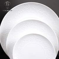 Ensemble de vaisselle en céramique ronde blanche de qualité supérieure en gros, motif en relief, pour hôtel et restaurant