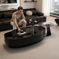 Ensemble de tables basses en verre trempé noir sophistiqué de forme irrégulière, style minimaliste moderne, adapté aux salons et aux halls d'entrée