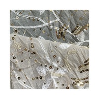 Tissu en mousseline de soie à sequins brodés en polyester de haute qualité100 % décoratif et beau pour le vêtement de ZhongZhe