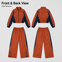Ensemble coupe-vent en gros avec pantalon large contrastant orange et bleu marine à fermeture éclair, faible MOQ, ensemble coupe-vent court
