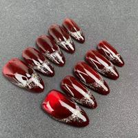 Vente en gros d'usine, faux ongles faits à la main de haute qualité, forme amande rouge, style œil de chat, réutilisables