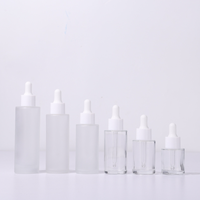 Flacon compte-gouttes élégant en verre transparent de 30 ml pour sérum facial, huile essentielle, soins de la peau, avec bouchon blanc, emballage cosmétique