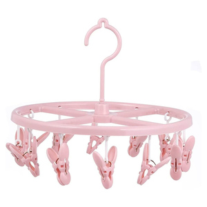 Séchoir à chaussettes multifonctionnel en plastique en forme de pétale, très vendu, avec 12 pinces - Product Image 1