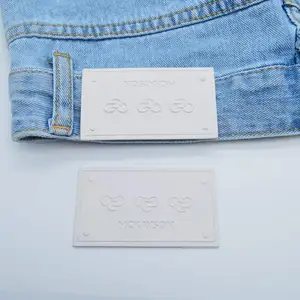 Produsen Grosir Logo Kustom Label Kulit Timbul untuk Jeans