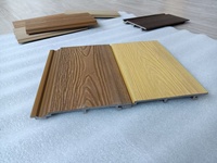 Panneau mural en composite bois-plastique (WPC) moderne, imperméable, ignifuge, pour usage extérieur en entrepôt/bureau, à lattes cannelées