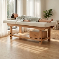 Table de massage professionnelle en bois bleu foncé sur mesure avec coussin de tête et tiroir pour usage en salon de beauté, SPA, hôtel, salle de sport ou salon.
