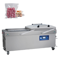 Pour les abattoirs de volailles : Emballeuse sous vide à double chambre et couvercle oscillant pour poulets entiers, cuisses et morceaux coupés