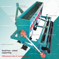Nouveau modèle de semoir agricole à quatre roues, chariot à main intégré, machine de semis et de fertilisation capable de semer des haricots et du riz