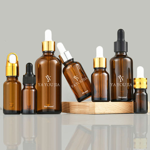 In magazzino 30ml 50ml 100ml bottiglia di vetro contagocce trasparente ambra bottiglia di olio essenziale di vetro con oro <span class=keywords><strong>e</strong></span> argento anelli tappo - Product Image 1