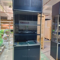 Vitrine personnalisée noire et or avec éclairage LED, meuble de rangement haut de gamme pour bijoux et montres, étagère murale de présentation de parfums
