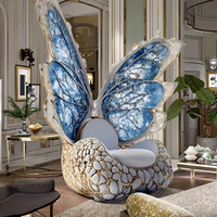 Fauteuil de salon de luxe individuel moderne et contemporain en acier inoxydable et cuir, avec dossier ailé et accoudoirs papillon, fait main