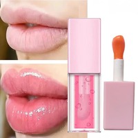 Nouveautés : Huile à lèvres crémeuse végane transparente, personnalisable avec logo, effet changeant de couleur, à l'acide hyaluronique, pour un effet repulpant léger.