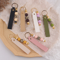 Porte-clés en cuir PU avec breloque de sac en silicone perlé imprimé léopard, pendentif de clé de voiture fait main, accessoire de mode féminin pour cadeau