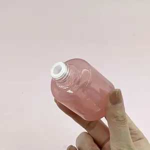 En çok satan 30ml pembe yuvarlak kalınlaşmak alt kozmetik ambalaj cam uçucu yağ damlalıklı şişe