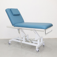 Table de massage électrique avec dossier et repose-jambes réglables, structure métallique, utilisation en salle de sport, salon, mobilier commercial, marque Curtis