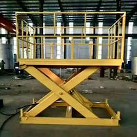Plateforme élévatrice à ciseaux électrique fixe 4-15m, table de travail hydraulique robuste en acier jaune, capacité de charge 500kg-50000kg pour l'industrie manufacturière