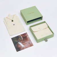 Emballage de voyage de bijoux imprimés avec logo personnalisé Pochette et boîte de sac à bijoux en microfibre à bouton pression