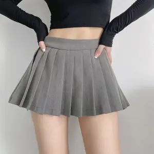 Bestseller westliche Damen sexy Mini plissierte Röcke einfarbige Mädchen kurzer Rock für Damen