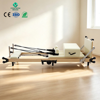 Lit de Pilates pliable en érable et chêne, réglage de la hauteur des jambes à 7 positions, rangement vertical, roues, équipement de fitness pour studio, CE ISO, garantie 5 ans, OEM
