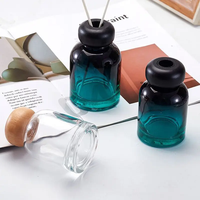 Bouteille diffuseur de parfum en verre rond de luxe personnalisée 100ml 150ml, en stock, vide, avec bouchons à vis en bois