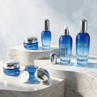 Ensemble de pots à crème pour le visage et flacons de lotion en verre bleu dégradé avec bouchon argenté pour l'emballage cosmétique