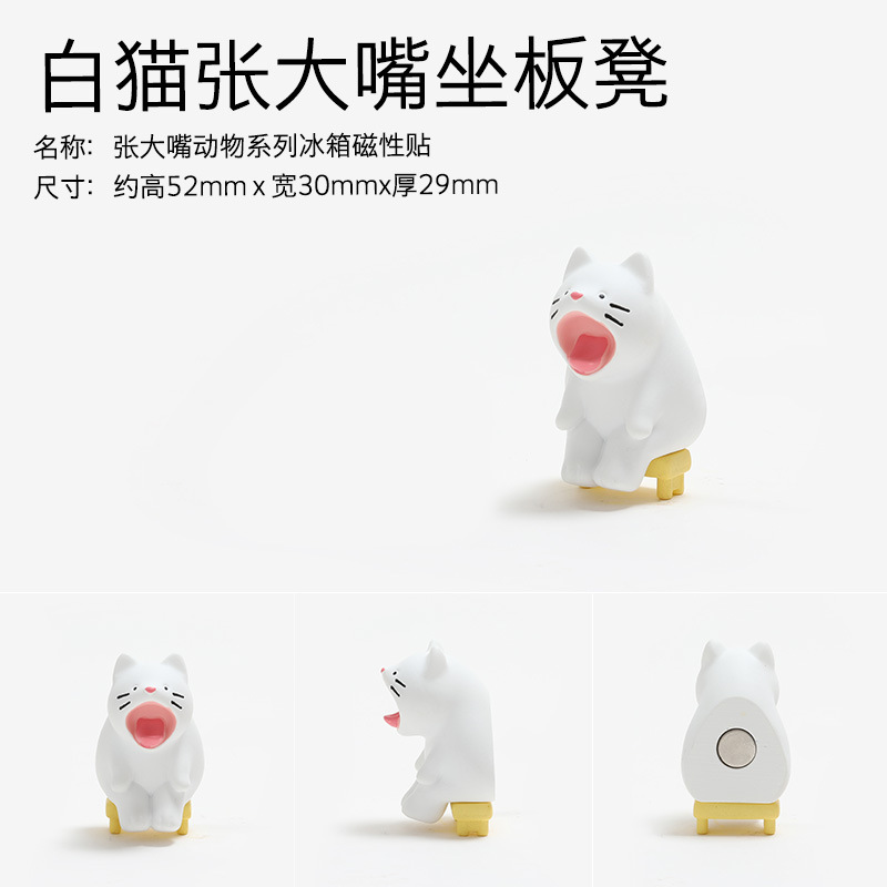 The white cat sits on the bench