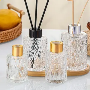 Luxury empty 50ml 100ml 130ml 150ml relief glass diffuser bottle sticks aroma reed diffuser oils bottle customize packing