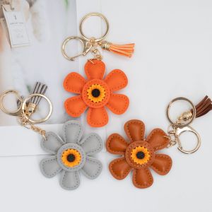 Le sac populaire, un accessoire best-seller sur Instagram, <span class=keywords><strong>porte</strong></span>-clés en cuir et <span class=keywords><strong>porte</strong></span>-clés créatif en émail tournesol, un cadeau original. - Product Image 1