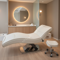 Lit de pose de cils ergonomique incurvé noir mat avec base en forme de croix, lit d'extension de cils, lit de spa beauté