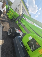 Mini-nacelle élévatrice verticale autotractée à bras articulé compacte pour opérations aériennes en entrepôt