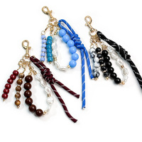 Article populaire : Pendentif de sac porte-clés à pompon en corde tressée, petit design, avec perles