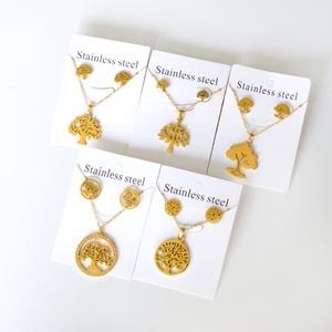 Collier et boucles d'oreilles personnalisés en acier inoxydable, forme ronde creuse, motif Arbre de Vie, ensembles de bijoux très demandés - Product Image 1