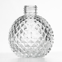 Bouteille de parfum en verre ronde de luxe personnalisée de 50ml bouteille de parfum unique à motif convexe concave en fond de montagne avec couvercle en marbre