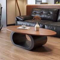 Table basse en bois massif de noyer avec un design minimaliste moderne, forme ovale, pour le salon