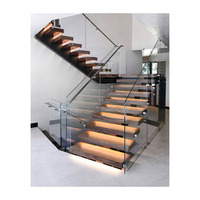 Escalier contemporain à poutre simple en bois avec balustrade en verre