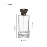 Flacon de parfum cylindrique de 100 ml avec pulvérisateur à pompe, boîte personnalisée avec logo, couvercle en zamac, bouchon en alliage de zinc, verre bleu de luxe