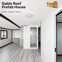 Maison conteneur ondulée à cadre noir de 20 pieds, 2 chambres, salle de bain complète, fenêtres coulissantes extensibles à double aile, moderne, ISO 9001 CE