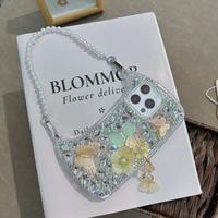 Coque de téléphone de luxe antichoc pour femme avec dragonne diamantée, strass, papillon, perle et fleur pour iPhone 13/14/15/16/17