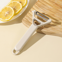 Éplucheur multifonction ergonomique tendance à double usage, couteau à fruits avec ouvre-bouteille, grattoir à peau de légumes pour la cuisine à domicile