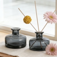 Bouteilles en verre rondes en gros pour flacons de parfum vides de 150 ml et 200 ml, avec remplissage de parfum en verre.