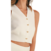 Vente en gros de gilet d'été personnalisé avec nœud et jupe de tennis courte, haut et short deux pièces, ensemble pull pour femme en maille fine