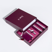 Boîte cadeau coulissante de luxe personnalisée de couleur violette avec insert en mousse EVA et logo estampé à chaud argenté pour l'emballage de rouge à lèvres