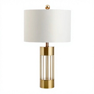 Lampe de table moderne en laiton avec abat-jour en tissu blanc alliant design architectural contemporain et élégance intemporelle - Product Image 2