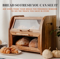 La boîte de rangement à pain à deux couches en bois d'acacia avec des couvercles de fenêtre en verre pour le stockage des aliments dans la cuisine.