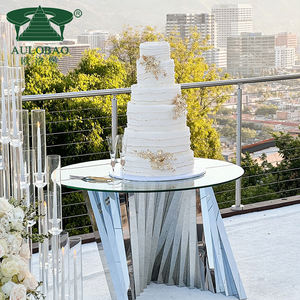 Mesas de dulces y pasteles decorados en acero inoxidable plateado para fiestas al aire libre - Product Image 1