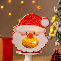 Décoration de Noël Lanterne Père Noël Lumineuse en Forme de Tête, Boîte en Carton Pomme avec Poignée en Fil Métallique, Décoration de Table pour les Fêtes