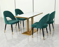 Hôtel nordique moderne luxe métal PU cuir rembourré chaise de salle à manger de luxe Table en marbre ensemble groupe pour 4 personnes