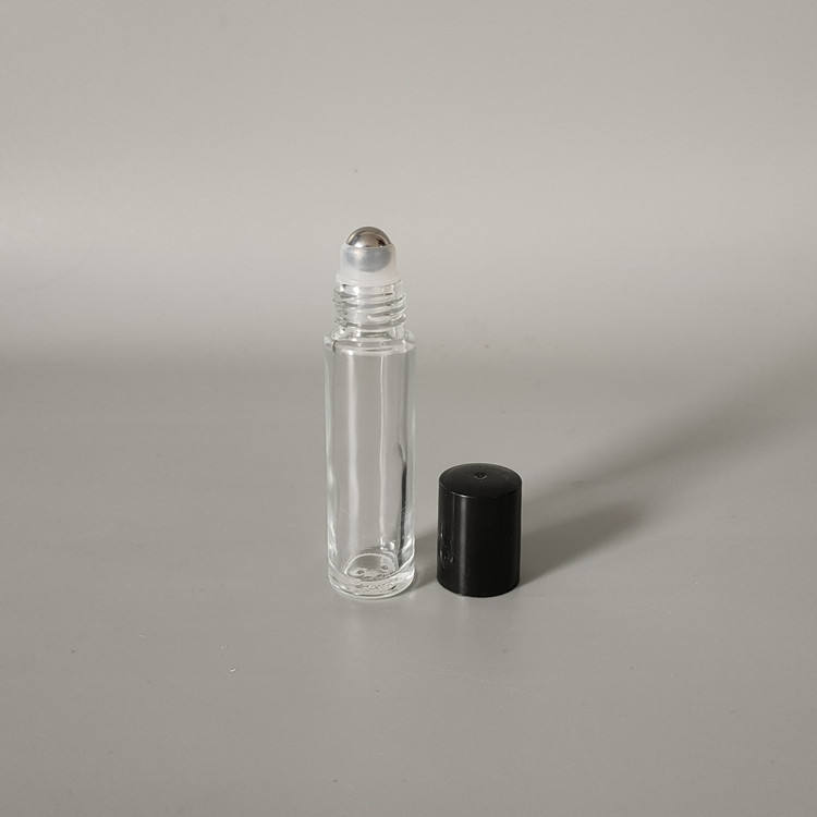 Clear bottle + steel ball + black plastic cap