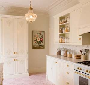 SANTOPOVA French-Style White Kitchen <b>Cabinets</b> with Ornate Carvings and <b>Gold</b>-Toned Handles - Product Image 2
