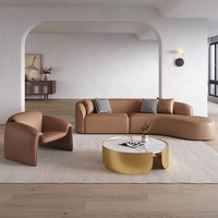 Ensemble de canapés en cuir italien moderne avec design arqué pour hall d'hôtel, comprenant canapé, chaise et table, pour mobilier de réception de salon